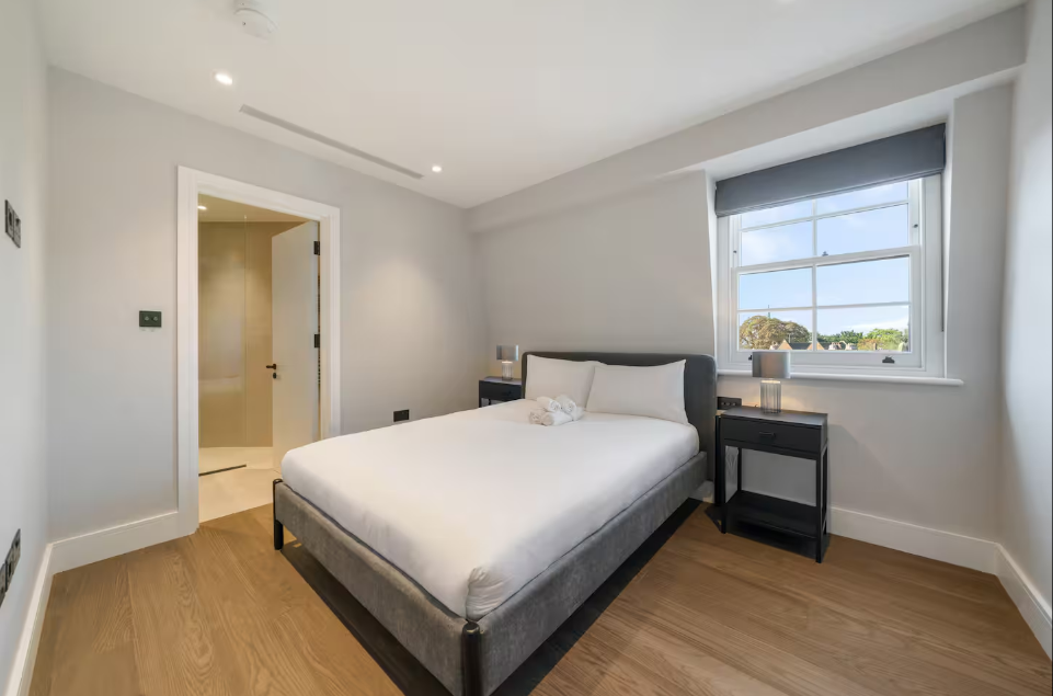 Minimal bedroom with double bed and sash window