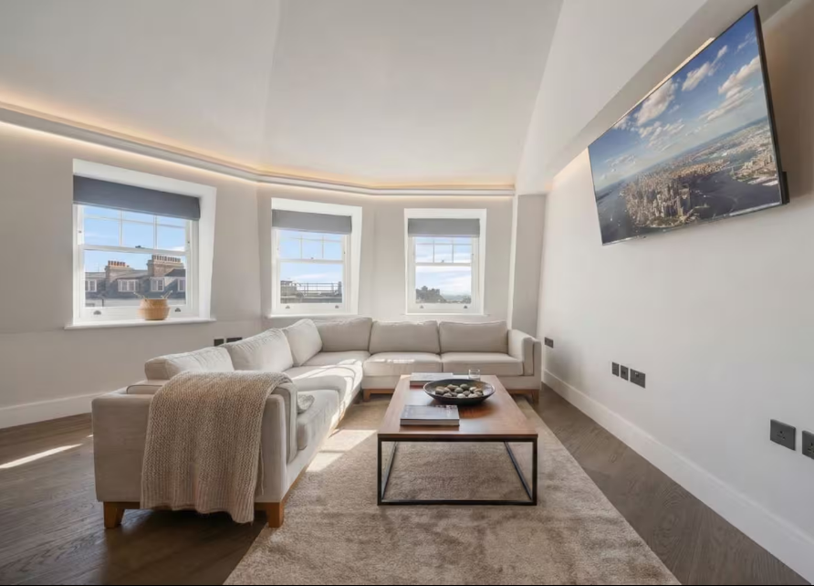 Luxury living room with corner sofa and wall-mounted television